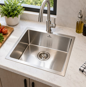 Alpha  43 × 38 cm handmade stainless steel kitchen sink with 20 cm deep single bowl and flat edge installed in a modern kitchen.